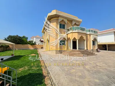 Luxurious villa in Sharqan featuring a private swimming pool, large garden, children’s play area, spacious terrace, majlis, two living rooms, and a ba