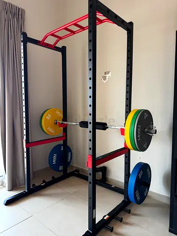 Power rack with barbell and bumper plates - good condition, barely used. I paid 5000 aed