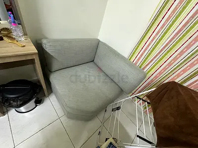 Light grey single-seater armchair in good condition
