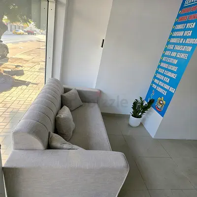 Light grey 3-4 seater fabric sofa in very good condition