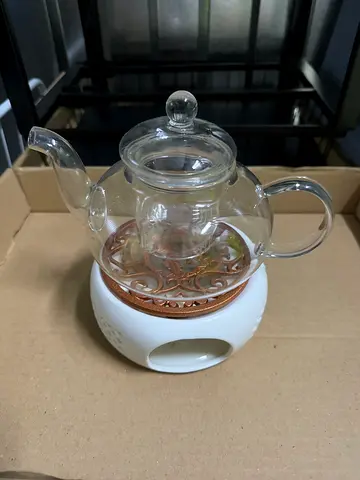 Glass teapot with infuser and warming base - good condition