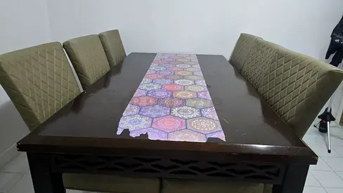 Solid dark wood dining table with 6 upholstered chairs (used)