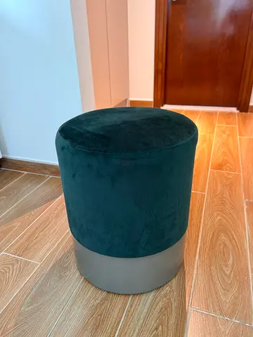 Dresser with a mirror and a green stool