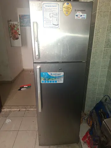 Silver double-door refrigerator - working, good for kitchen