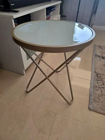 Small round side coffee table with glass top and metal base