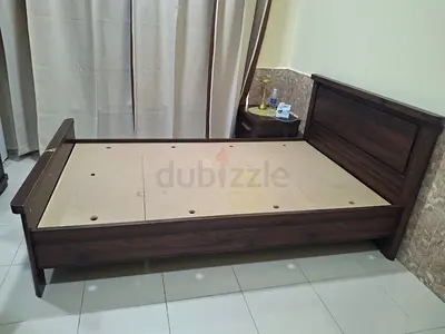Single bed with mattress and side table