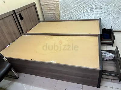 2 single wooden bed frame with storage drawers - used