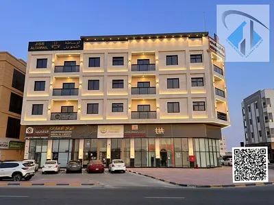 Corner building for sale in Al-Aliya, Ajman; fully leased and featuring excellent finishing.