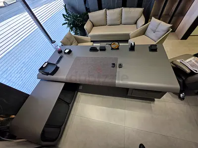 Modern executive office set: desk, sofa and chairs in beige leather