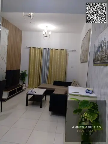 Annual Rent | Fully Furnished 1BR in Lavender Tower, Emirates City, Ajman. High floor, closed kitchen, open side view near MBZ Road. AED 35,000 yearly