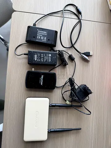 Used wireless router and assorted network adapters with power supplies