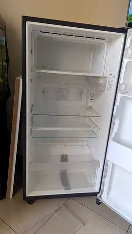 Single door refrigerator (empty door shown) - good working condition
