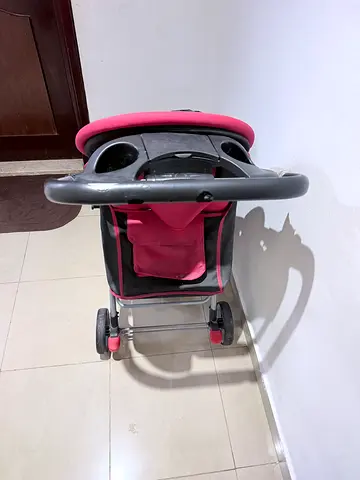 Lightweight pink baby stroller / pram - good condition