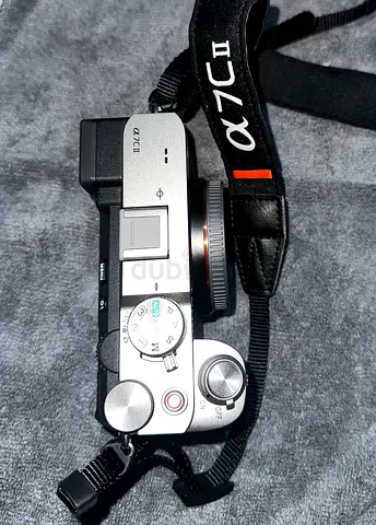 Sony a7CII Mirrorless Camera (body only) with neck strap