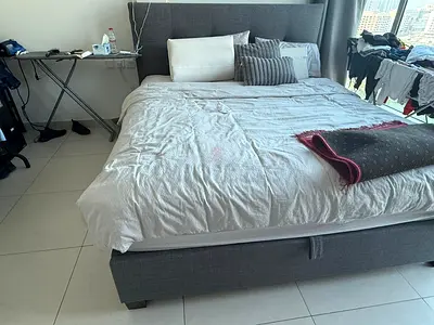 Grey fabric queen bed frame with headboard - good condition