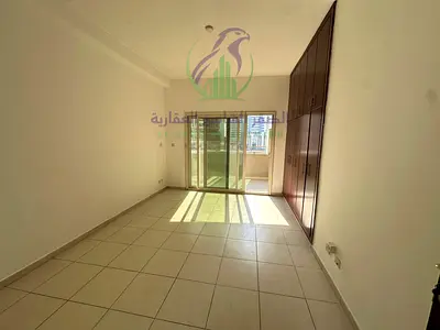 Spacious 3BR apartment in Al Taawun with maid's room, balcony, free parking, pool, gym, and kids' play area.