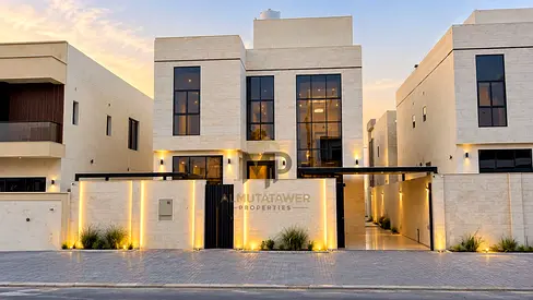 Luxury villa for sale in Ajman, featuring high-end finishes and a modern design; the price includes ownership registration fees.