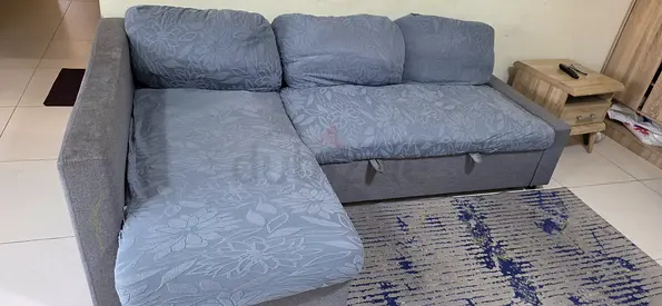 L-shaped grey fabric sofa with storage - good condition