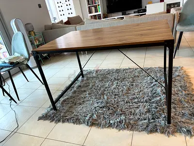 Dining table for four with wood top and metal legs