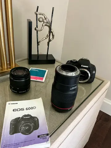 Canon EOS 600D DSLR body with two lenses and manuals