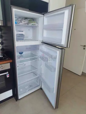 Used top-freezer refrigerator, good condition, 2-door stainless finish
