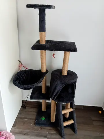 Used multi-level cat tree with scratching posts and cozy baskets
