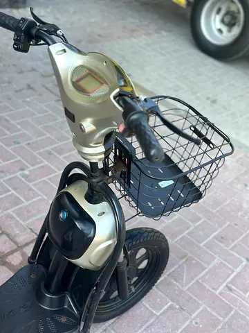 Used Electric Scooter with Front Basket – Good Working Condition