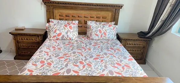 Solid wood double bed with matching bedside tables - good condition