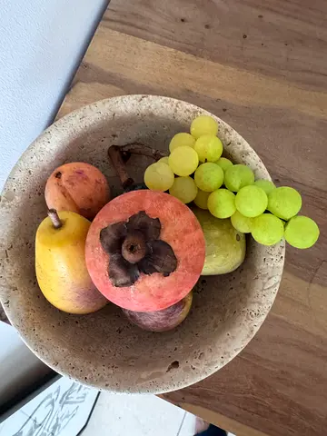 Stone travertine decorative fruit bowl with faux fruits — good condition
