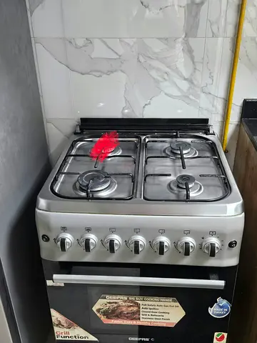 Stainless Steel 4-Burner Gas Stove with Oven - Good Working Condition