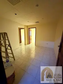 Two-bedroom apartment with living room for annual rent in Al Butina, Sharjah, behind Nesto. Spacious