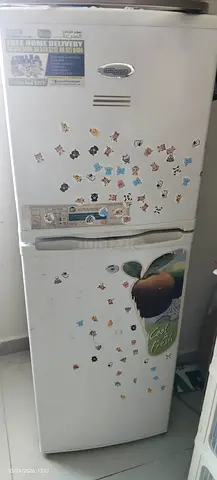 Used double-door refrigerator - working, with stickers