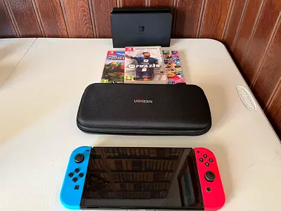 Nintendo Switch OLED Model | 3 games + mount dock + travel case included | Used once, original box