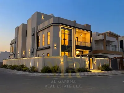 A distinctive villa for sale in the Al Yasmeen area, Ajman. It features two floors plus a roof terrace and boasts a strategic corner location. The pri