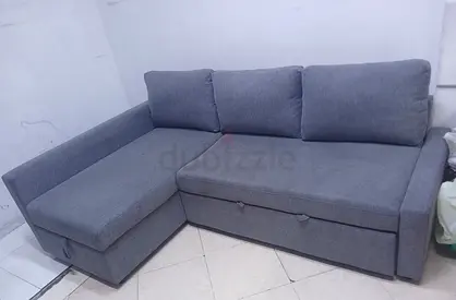 Grey L-shaped sofa with storage, good condition