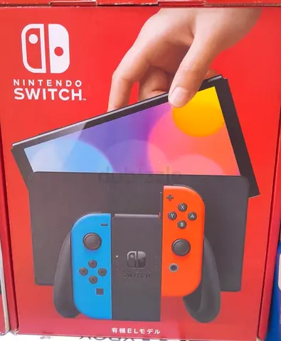 Nintendo Switch OLED Model with blue and red controllers - Brand New
