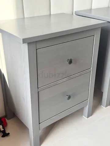 Light grey wooden bedside table with two drawers