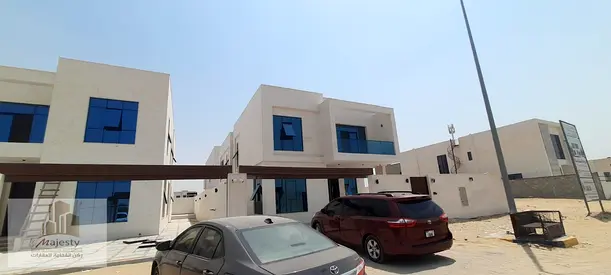 Villa for sale in Sharjah, Al Hoshi area. It has two floors, 5 bedrooms, a built-up area of 5400 sq ft, a spacious family hall, and parking spaces.