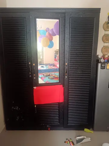 Three-door wooden wardrobe
