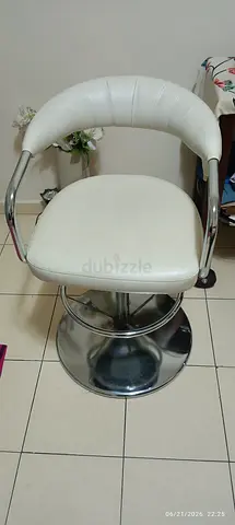 White leather swivel bar stool with chrome base