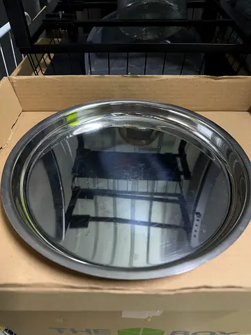Round stainless steel serving tray with rim - 24 cm (used)