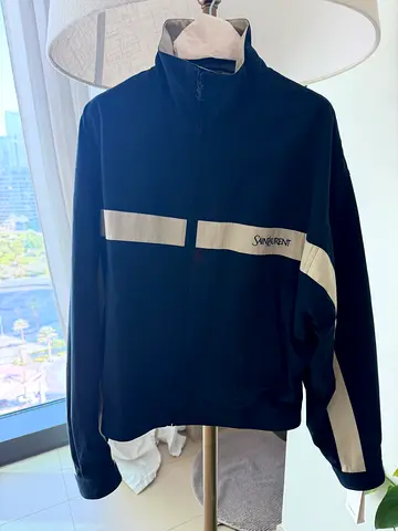 Men’s size 44 (XS) Saint Laurent windbreaker. New with tags, receipt and travel bag. Unworn.