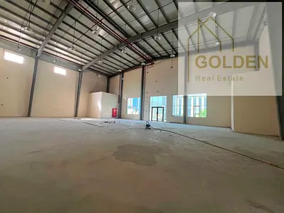 Warehouse for rent in the heart of the Modern Industrial Area, Umm Al Quwain, with 60 KVA power, direct street frontage, easy access for trucks and commercial vehicles