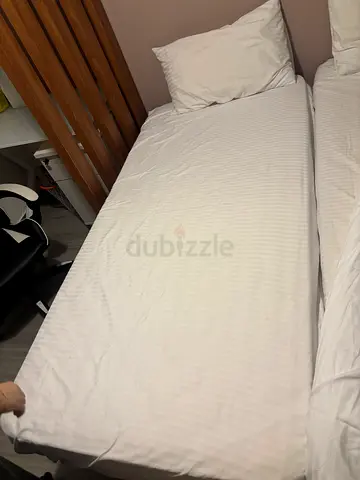 Single bed with white mattress and bedding - good condition
