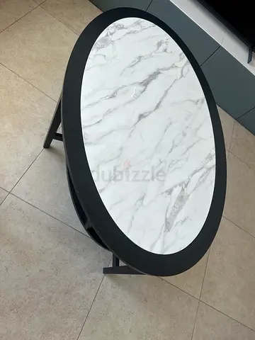 Oval glass-top (wrapped with marble finish)coffee table - good condition