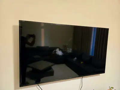 65-inch LED Smart TV - Wall Mounted, Good Condition