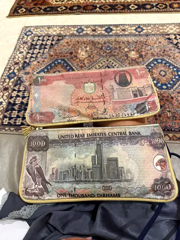 Pair of wallets/ pouches with Dubai denominations. Sold together