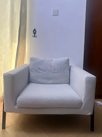 Light grey fabric single-seater armchair with cushion