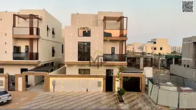 Luxury villa in Al Helio 2, opposite Al Hamidiya Park. Features a garden and a terrace. The price in