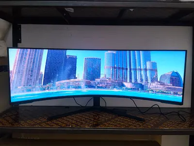 The Samsung Odyssey Neo G9 (LS57CG952NUXEN) is a 57-inch, 1000R curved gaming monitor featuring Dual